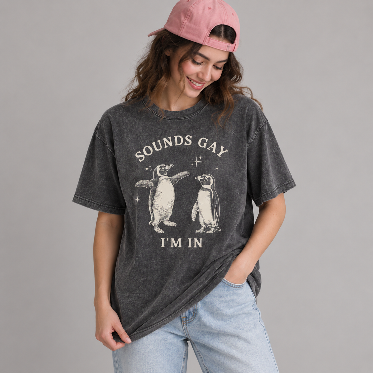 Woman wearing the Sounds Gay, I’m In T-shirt in washed charcoal
